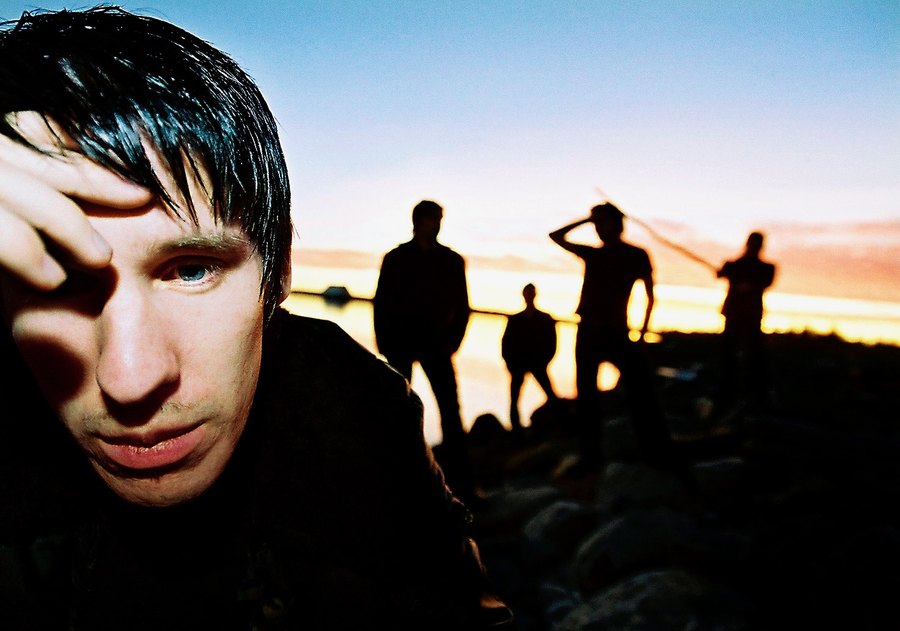 The Drowners at dusk by the shoreline